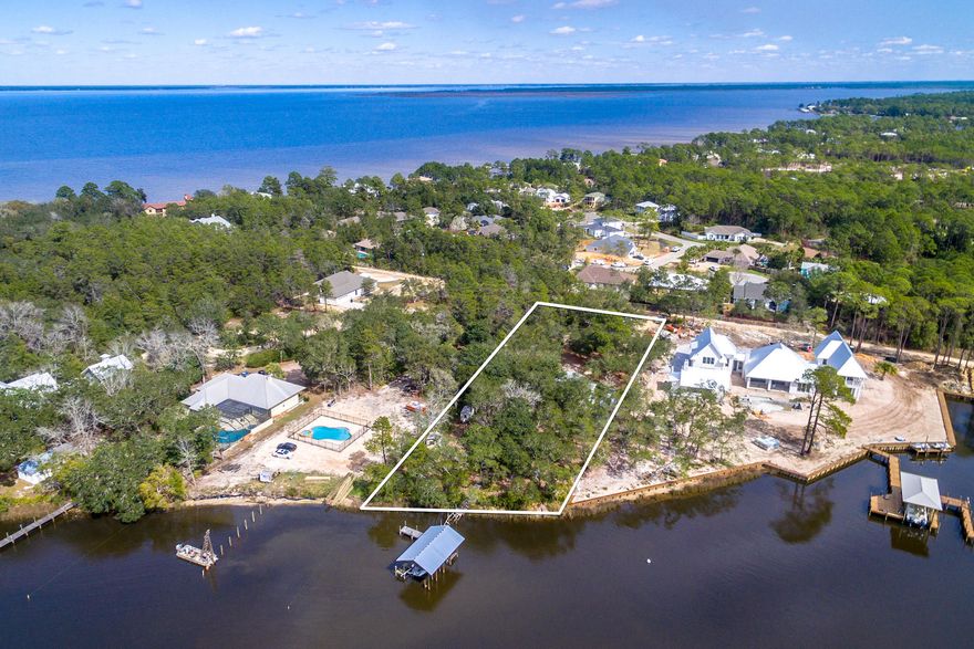 Exceptional estate-sized, waterfront lot with stunning views of Mack Bayou and the Choctawhatchee Bay! Gorgeous moss-filled live oaks offer a majestic setting on which to build your dream home or simply a quintessential Florida cottage! Adjacent multi-million dollar new home construction clearly indicates the allure of this private waterfront enclave. A mobile home currently exists on the subject property and will be conveyed to the Buyer in its ''As-Is, Where-Is'' state and condition, and shall be the responsibility of the Buyer to remove and dispose. Buyer must verify all information and specifications.