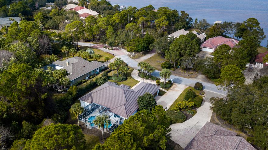 Across the street from the Bay in the prominent community of Emerald Bay sits a luxurious cozy abode designed for the finest Florida living. This home has been completely remodeled in every facet and updated to host top notch finishes from the salt water pool, to the bathrooms and the kitchen. With two separate living areas and a gourmet kitchen, this home provides ample space for family gatherings or entertaining guests. The family room is the perfect spot to settle in for a cozy night at home with a large gas fireplace and a view of the pool. The office/library provides an ideally separate, quiet space to read or work. The home's large lot boasts a peaceful setting for various outdoor spaces with privacy in mind.