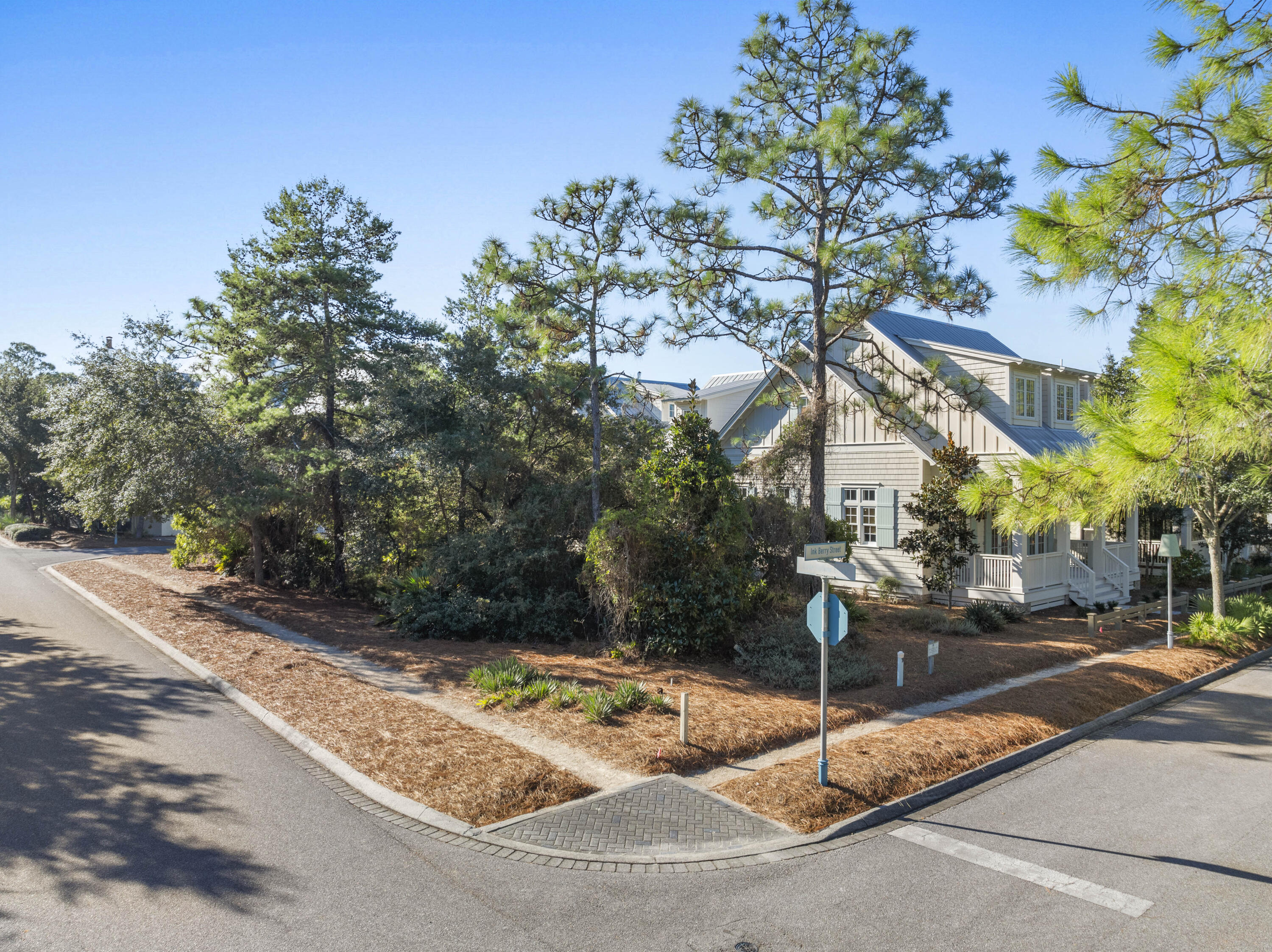 Don't miss this rare opportunity to build a brand-new home on one of Watercolor's few remaining lots in the highly desirable phase III (where short-term rentals are allowed). This generously sized corner lot overlooks Longleaf Park with tranquil views of the state forest beyond and just steps away from Watercolor's famous neighborhood Frog Pool. Perfectly situated in a secluded area, yet just minutes away from the hustle and bustle of 30A and all that Watercolor and Seaside have to offer. Watercolor remains one of Scenic 30A's most exceptional planned communities, renowned for its unmatched amenities, from the world-class Beach Club, kid friendly Camp Watercolor, highly acclaimed tennis center and workout facility, Western Lake Boathouse and miles of scenic walking and biking trails. Neighboring Seaside, the iconic 30A beach town, is just a short stroll or bike ride away, offering some of the area's finest dining and boutique shopping. This is a truly special opportunity to build your dream home and experience the very best of 30A coastal living in one of its most sought-after locations. Fully approved architectural plans by Greg Jazayeri Design for a 2-1/2 Story, six-bedroom, six-bath main home and carriage house are available, yielding more than 4,200 square feet of beautifully designed living space, plenty of room for the entire family. Start construction right away, or design your own custom beach getaway. The possibilities are endless.