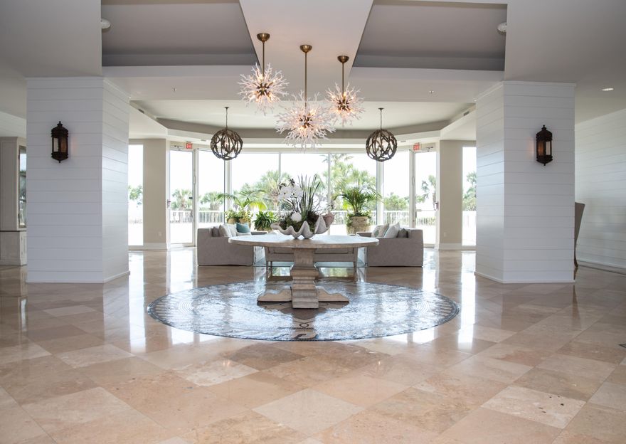 step off the semi private elevator and start enjoying these breathtaking views of Emerald water with white sand and swaying palms. The condo has two Master gulf front bedrooms and 1 bedroom in back, updated private baths. Large balcony where everyone can enjoy the beautiful beach. The foyer, living/dining and kitchen have tile flooring, granite counter tops and stainless steel appliances. Ruth's Chris steak house, beverage, and food service for the pool, spa, fitness facility, tennis courts, basketball courts, pools. This is a must see unit, Rarely does a condo this amazing come up for sale.