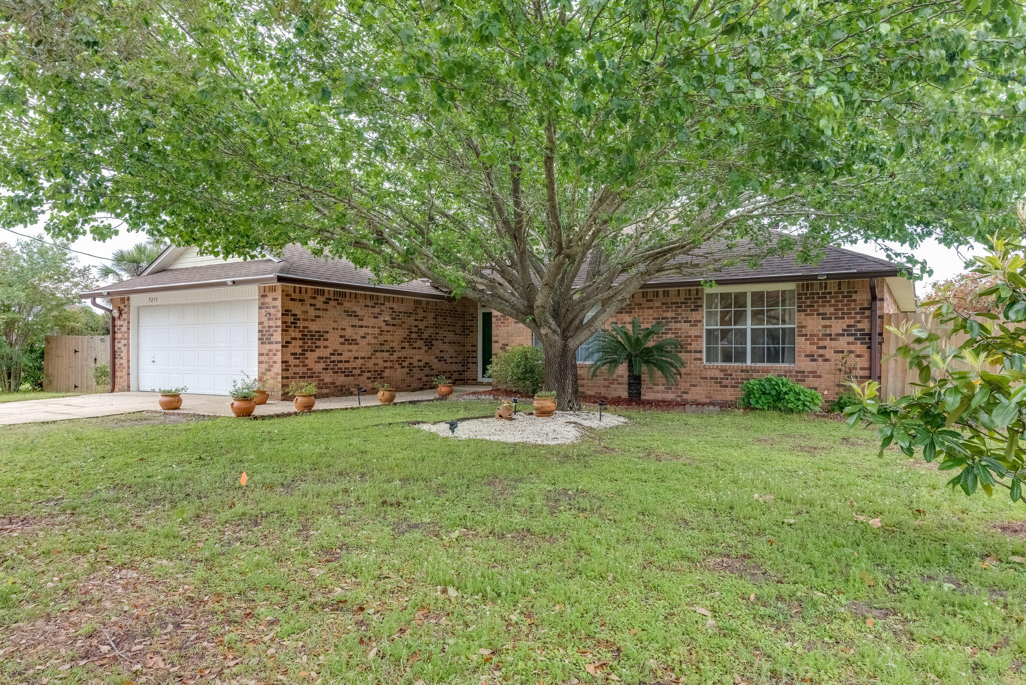 Your new home is ready for you!! The home is located on a quiet cul-de-sac. Walk into a large living space with beautiful Bamboo flooring & plenty of natural light. You can even cozy up to your fireplace on a quiet night. From there you have a breakfast nook and ceramic tiled kitchen to make your very own with plenty of counter space& island! The split 3 bed & 2 bath allows plenty of room for everyone. Bedroom closets have custom shelves to maximize the area. A fenced in yard allows you to relax on your open porch. Home also has a 3 year old Roof and new gutters were just installed! Front storm door& rear sliding door were installed 2018. You even have a Shoreline RV 30amp hookup. With minutes away from Navarre Beach and shopping this home will not last. You do not want to miss out!!!
