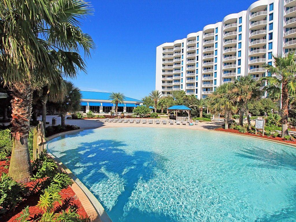 One of the most desired views from the the Palms Resort is one that overlooks the pool...Welcome to your view from your balcony! This unit is a 2BR/2BA which sleeps 6! Sleep comfortably on your Master King size bed while your guests sleep in the 2 twin size beds in the other spacious bedroom! Both rooms and living rooms have been equipt with large flat screen tv's! Gorgeous furnishings to make you feel at home. Spacious kitchen with granite to prepare meals and entertain guests! You have your own washer & dryer to make life easy! The 11,000 square foot is DESTIN'S LARGEST LAGOON POOL!You'll be blown away by the 5 dancing waterfalls, spacious lounging area and A+ shuttle service to local areas/beaches.There's a 21,000 gallon STEAMY heated pool, children's area + MORE! Hoa fees include elect