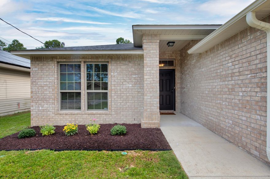 New to the Navarre marketplace is 8252 Tavira street; now presenting this brick 3 bedroom, 2 bathroom widely enjoyed floor plan that has been maintained meticulously. Located centrally to everything that makes Navarre desired, you will love driving just minutes to the beach. The landscaping is immaculate, to include a recent mulch and garden frontage. Once inside, you're greeted by vaulted ceilings throughout the living space, a stunning granite kitchen with stainless appliances, and LVP flooring extended throughout. Natural light pours into the home in each room. Inside the quaint master bedroom is one of the largest closets available in any home of this price range. Out back, the options are limitless with making the yard your own oasis. Don't forget about the extended driveway for RVs! Built in 2015, enjoy maintenance free living.