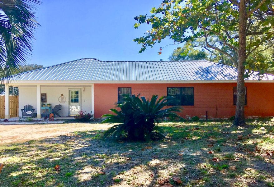 SUPER CUTE 3 bedroom home in Elliot's Point. 3 bedrooms, bonus room and Florida room make for a spacious home. Recent upgrades include - electrical, plumbing and paint. No carpeting for easy flooring care. Beautiful heated and cooled sunroom directly off the kitchen could be used for dining room or additional living space. New kitchen island with bright, white cabinets. HUGE storage shed with complete with electricity would make a great workshop or craft room. This one won't last long.