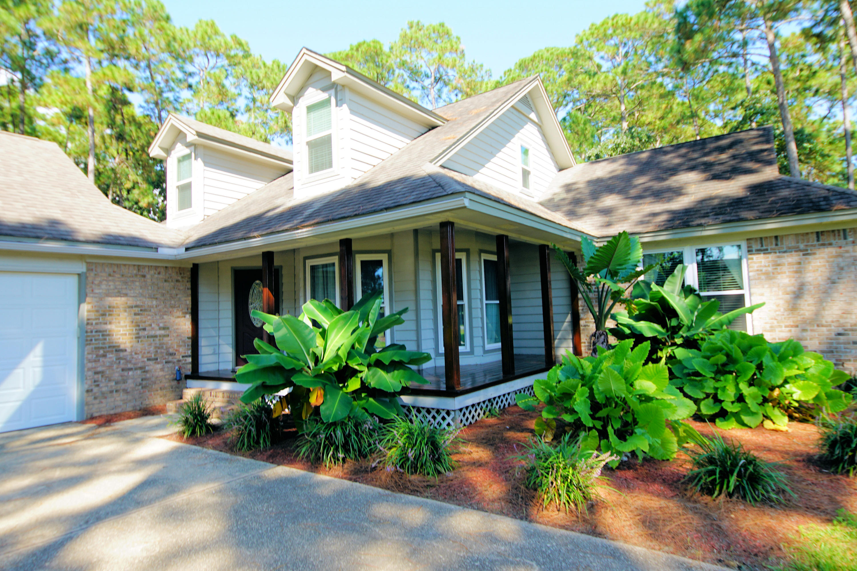 Stunning two story home with Views of Choctawhatchee Bay located on 1/2 acre private lot. Enter a lovely covered porch with leaded glass door to a foyer leading to a sprawling living room with cozy fireplace and dark ''wood'' ceramic tile flooring. Adjoining 17'X 21' heated and cooled Florida room bathed in natural light from surrounding windows has slider to private back yard deck. Spectacular kitchen featuring a center island, Jenn-Aire smooth cook top, granite counters, walk-in pantry, and stainless appliances leads to spacious dining room. First floor Master bedroom and en-suite bath serve as a private retreat. Dormer windows add charm to the two bedrooms located on second floor. Huge 3 car garage and attached workshop will suit anyone's need for a man-cave or workshop.