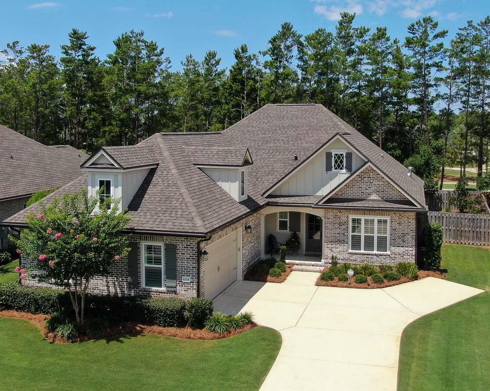 Must see this beauty in the sought after Meadows neighborhood of Randy Wise homes. Sits on a culdesac street and is better than new, check out all the upgrades & features that you will fall in love with: low maintenance brick, plenty of parking spaces, front windows have plantation shutters, whole house water softener, tankless water heater, shiplap on 3 walls, custom floating shelving & range hood, SS appliances, farm house sink, upgraded light fixtures, beautiful brick gas fireplace, coffee bar, quartz counter tops, lots of extra storage, huge island, tile backsplash, oversized office with double doors, privacy fence, paver patio area, screened-in back porch over looking a beautiful, relaxing & low maintenance back yard oasis. Must see this one quick!