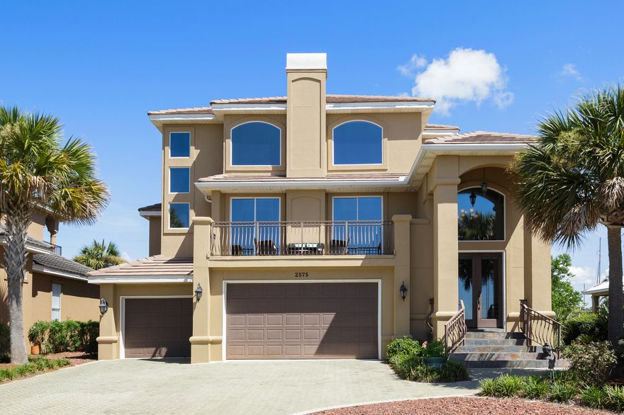 Stunning views of the Bay or marina from just about every room in this home. Windows everywhere. The entire first floor is a mother-in-law suite (or lock-out apartment) with private entrance, two bedrooms and shared bath, its own garage, spacious living area with backyard paved deck, laundry hook-up and full kitchen with granite and stainless appliances. The main living area on the second floor is one massive space with soaring two-story ceilings, gas fireplace, main kitchen with dual pantries, dining area, and large balcony overlooking the Two Georges Marina. This floor also has the master bedroom/bath with a jetted tub and separate tiled shower, a half bath for guests, and laundry room. Flooring is engineered hardwood and travertine throughout. At the top of the stairs to the third floor is a spacious hardwood landing with the best Bay views in the house. This bonus area is large enough to use as an office space. Off the landing are doors leading to the fourth and fifth bedrooms with private balconies and shared bath with dual granite vanity and shower/tub combo. Three separate A/C systems and thermostats control the comfort levels of each floor. Beautifully landscaped but with no lawn to mow. Room for a pool in back. Walk across the street to the community water access for some swimming, kayaking or paddle boarding. Transferable termite bond. 3-car garage. Store your boat across the street at the marina and still have room for two cars and a golf cart. Despite being practically waterfront, this property is in an X Zone. No flood insurance required. The gated community of Casa Marina is situated within seven minutes of both FWB Medical Center and Eglin AFB. It's also a short golf cart-ride to the Shalimar Point Golf Course and the Meigs public beach. Home is in an "X" flood zone, so no flood insurance required.