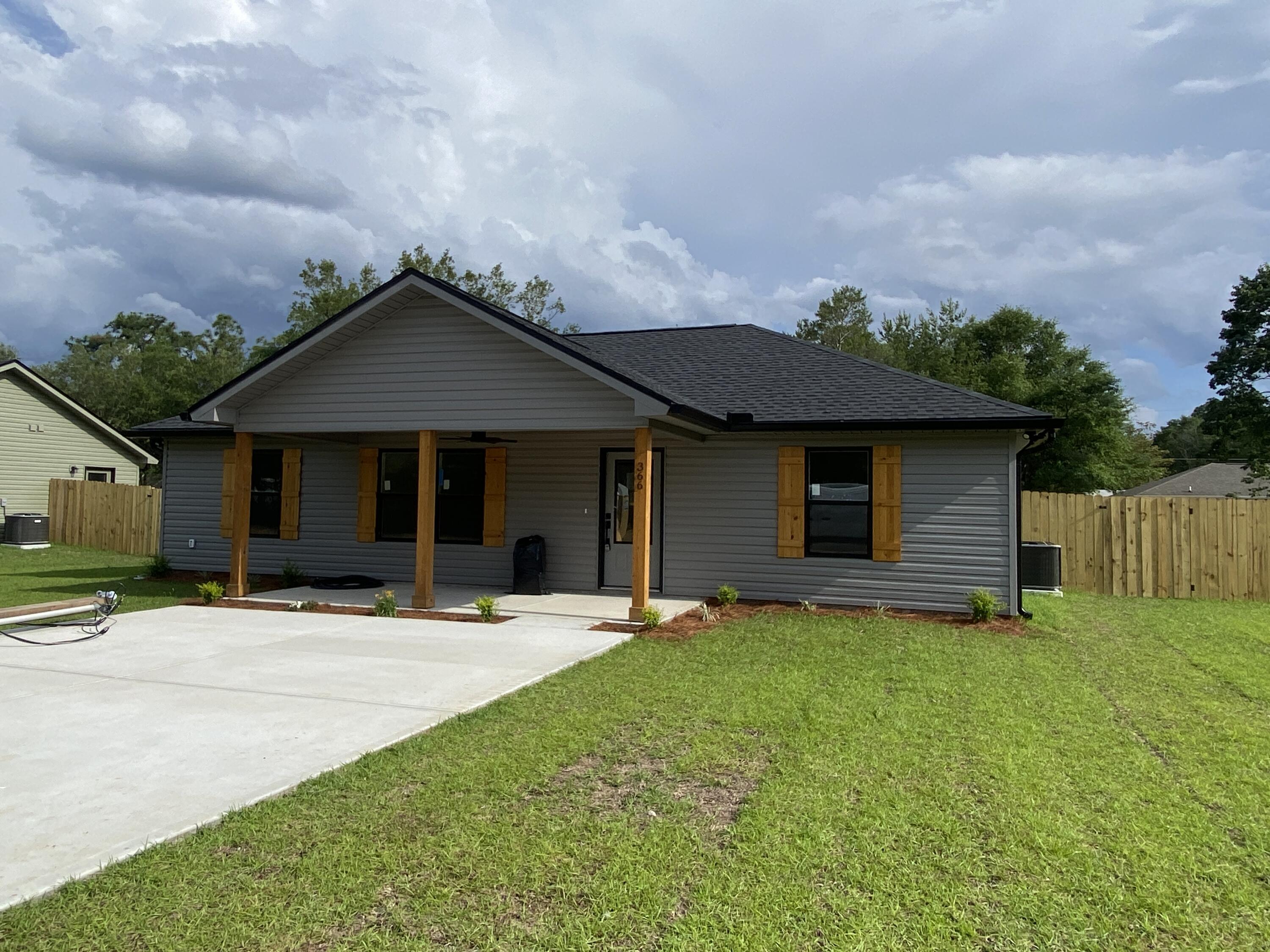 Set on nearly a quarter-acre, this move-in-ready home offers the ideal mix of modern features, low-maintenance living, and peaceful surroundings. You'll love the charming curb appeal with a covered front porch, cedar-wrapped posts, and a warm cedar-clad ceiling, an inviting space to enjoy your morning coffee or unwind after a long day. Inside, the open-concept layout feels bright and spacious with vaulted ceilings and durable Luxury Vinyl Plank flooring throughout, perfect for busy lifestyles and easy upkeep. The kitchen is designed for both style and function, featuring quartz countertops, soft-close cabinets, a stainless farmhouse sink, and all stainless steel appliances included so you can start living from day one. Cont... The private primary bedroom offers a relaxing retreat with a walk-in closet and an ensuite bathroom complete with double quartz vanities, custom-tiled walk-in shower, and beautiful tile flooring. Two additional bedrooms offer plenty of room for guests, a home office, or a growing family. With thoughtful design, modern finishes, and a quiet location just minutes from town, this home is a smart and stylish choice for those looking to downsize or first-time buyers. Don't miss this opportunity, your next chapter starts here!
Road is scheduled to be paved in 2027.