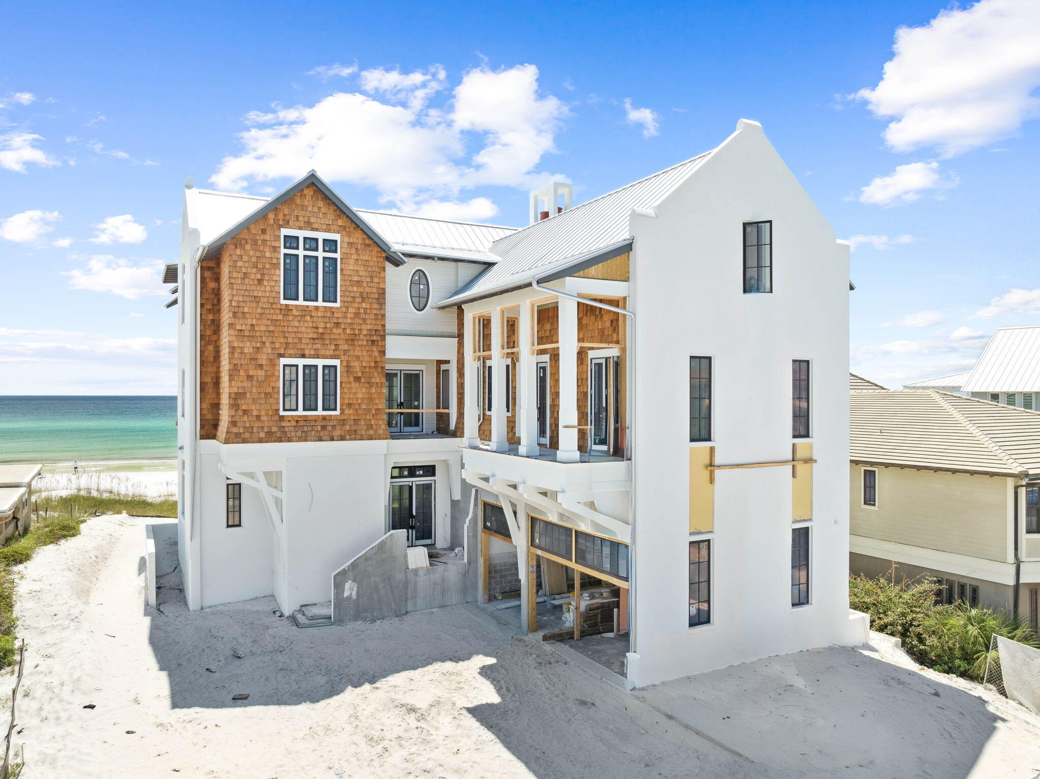 Designed by the acclaimed Geoff Chick & Associates and expertly constructed by Cogent Building Group, this newly completed Gulf-front estate at 5673 W County Highway 30A represents one of the most compelling offerings along Florida's iconic 30A corridor. Encompassing approximately 6,944 square feet across three thoughtfully curated levels, the residence delivers eight bedrooms and nine bathrooms, pairing architectural sophistication with a lifestyle defined by effortless luxury.From the moment you enter, expansive, light-filled living spaces frame uninterrupted Gulf vistas, creating a sense of connection to the coastline that is both immediate and profound. Multiple covered terraces extend the living experience outdoors, while a Gulf-facing pool and private beach access invite you to embrace the shoreline as part of daily life.
Every element of this home reflects an unwavering dedication to quality, from its premium materials and refined finishes to a floor plan designed for both grand entertaining and intimate living. Early purchasers also have the unique opportunity to customize select interior details, ensuring the residence reflects their personal vision.
Perfectly positioned along one of 30A's most coveted stretches of sand, this property is more than a coastal retreat, it is a rare opportunity to own a signature beachfront estate where timeless design, scale, and location converge.