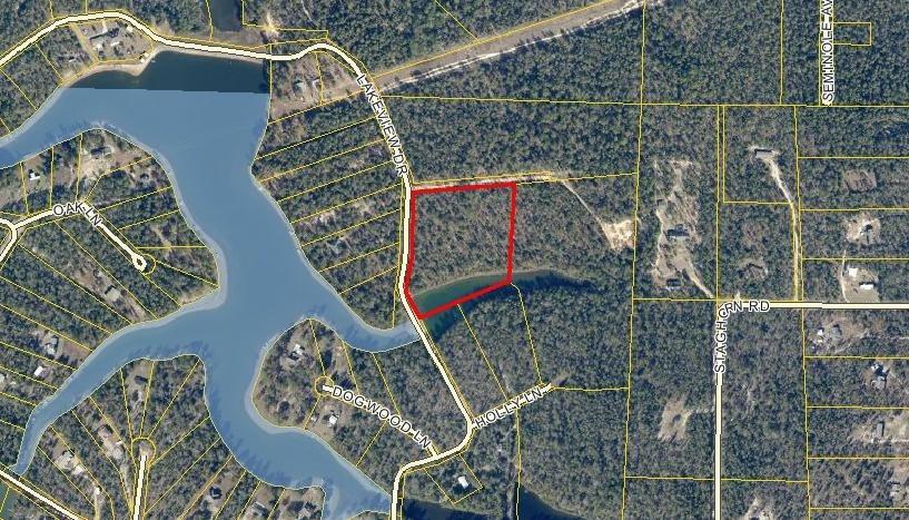 Beautifully wooded 2+ acres of land on a lake/pond. The property extends into the center of the lake/pond and the acreage represented includes the portion in the lake/pond. This is an ideal location for your new home, a second home or a weekend hideaway. The only restrictions would be county zoning. Electric and phone are available on Lakeview Dr. Water service would need to be verified. Dimensions and acreage are estimated. This is one of 3 parcels that are being split out of a 7+ acre parcel. Taxes and parcel ID are for the total parcel. Buyer to verify any information of importance to them, with the proper authorities.