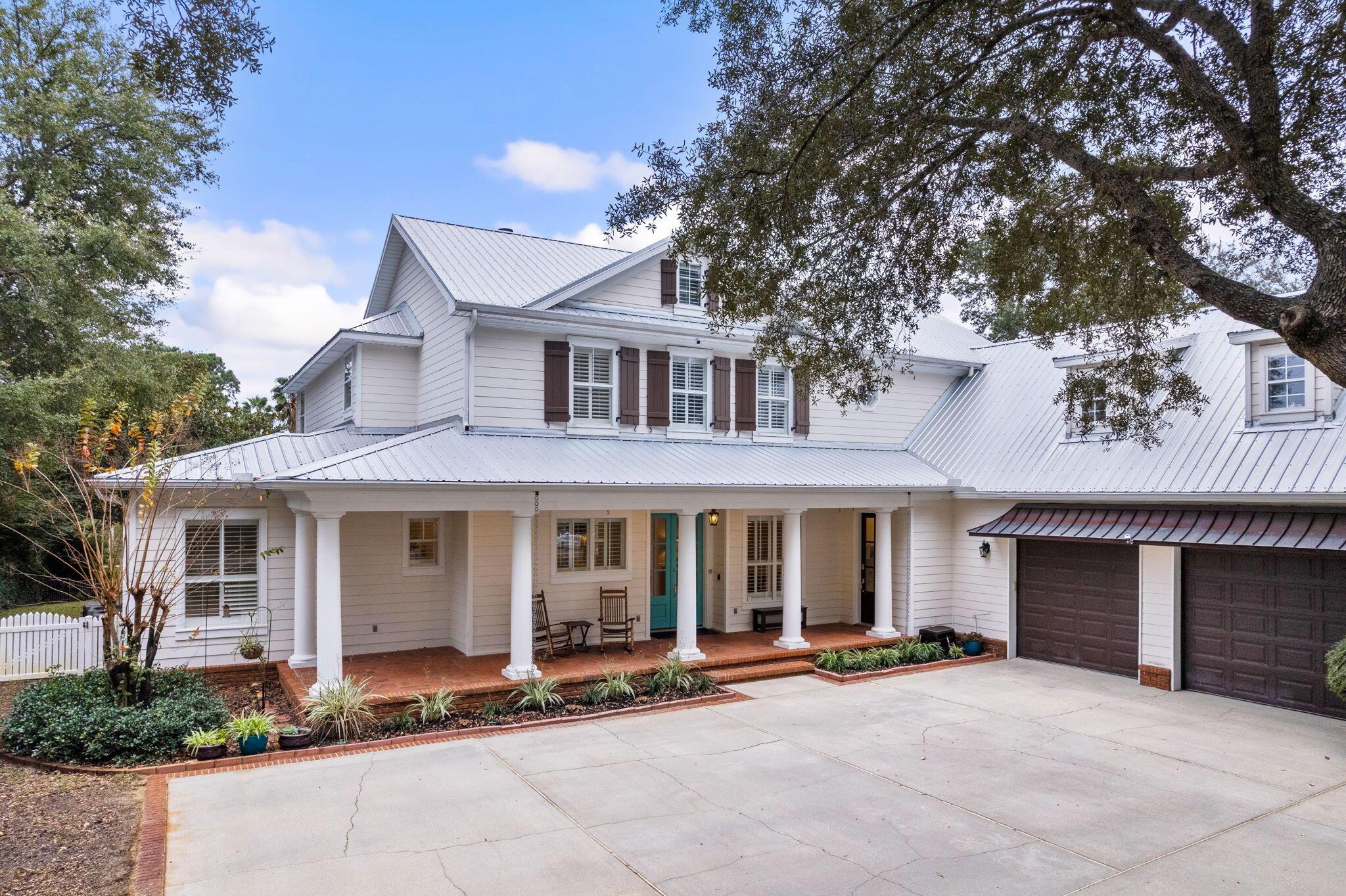 Charming Southern architectural design paired with deep water boating access and exceptional bayou frontage characterize this beautiful family home located in the heart of Destin, Florida. Traditional design details and mature native foliage enhance the sense of arrival on this expansive five bedroom, four and one half bath residence. Notable details include 100' of canal / bayou frontage with an electric boat lift and outstanding outdoor living space including a private resort style pool as well as a surrounding patio with covered lanai including a gas grilling area and entertainment space.