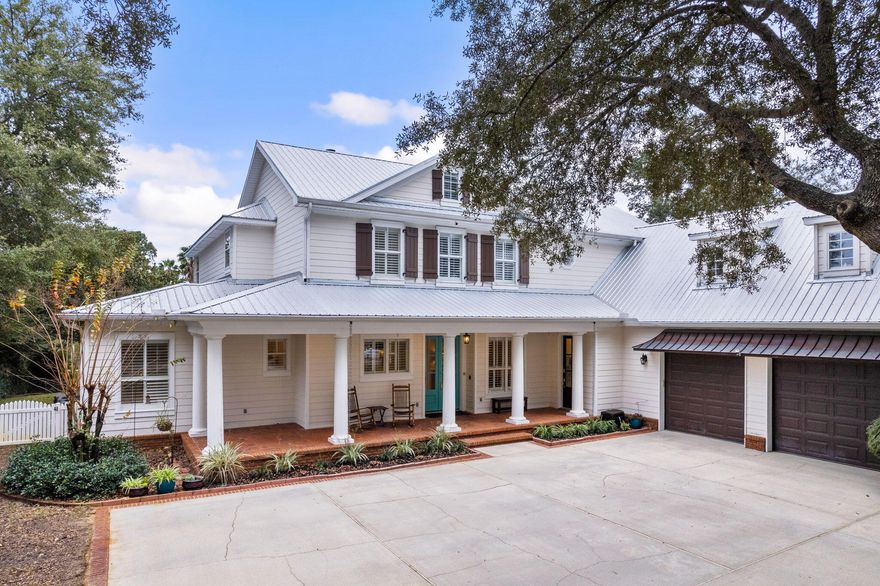 Charming Southern architectural design paired with deep water boating access and exceptional bayou frontage characterize this beautiful family home located in the heart of Destin, Florida. Traditional design details and mature native foliage enhance the sense of arrival on this expansive five bedroom, four and one half bath residence. Notable details include 100' of canal / bayou frontage with an electric boat lift and outstanding outdoor living space including a private resort style pool as well as a surrounding patio with covered lanai including a gas grilling area and entertainment space.