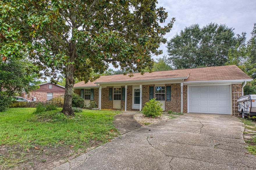 This home is a must see !!!! Fantastic location in Gulf Breeze with stop light at subdivision entrance.  3 bedrooms 2 bath.  Close to everything.  Large lot with new back deck. Features 42'' upper cabinets and granite counter tops in beautiful large kitchen, with pantry.  Inside laundry room.  Everything you need to make this home your own.