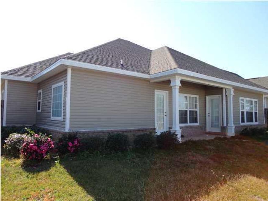 Freshly painted and New Carpet! This house has many upgrades such as; vinyl insulated windows, deluxe trim package, 20'' porcelain tile throughout kitchen, bathrooms, foyer & laundry room. The laundry room is located next to the bedrooms for easy access and comes fully equip with a laundry sink. This home features a designated computer work area with custom cabinetry. It also features a large spacious kitchen with breakfast bar and it includes a whirlpool refrigerator with ice maker, dishwasher, microwave and a smooth top stove. The kitchen finishes out with beautiful wood custom cabinetry. Another desirable feature is the master suite with two spacious walk-in closets, large vanity space, cultured marble whirlpool tub and