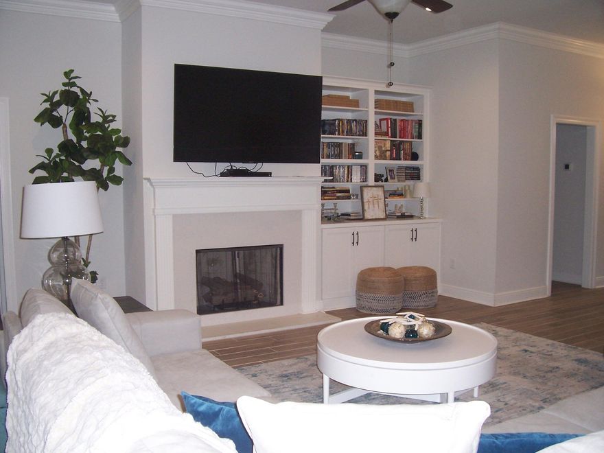 Beautiful Hammock Bay Home!  This 2,204. sq. ft 4 bedrooms 2 bath home is located in The Trails of Hammock Bay.  The home has many notable features and upgrades including, spacious open floor plan, wood look tile flooring throughout except the 3 guest bedrooms are carpeted, beautiful white cabinetry, quartz countertops, stainless appliances, Gas Fireplace, custom built in cabinetry adjoining the fireplace, large master suite, lots of storage, large laundry room, boot bench, screened porch, paver patio, privacy fence, gutters and a new lawn pump system!  Hammock Bay amenities include, Clubhouse, Beautiful pools, Playground Pickleball, tennis courts and walking and biking trails.  Also, Hammock Bay offers a General Store, Props Brewery and Food Trucks for your convenience and enjoyment!