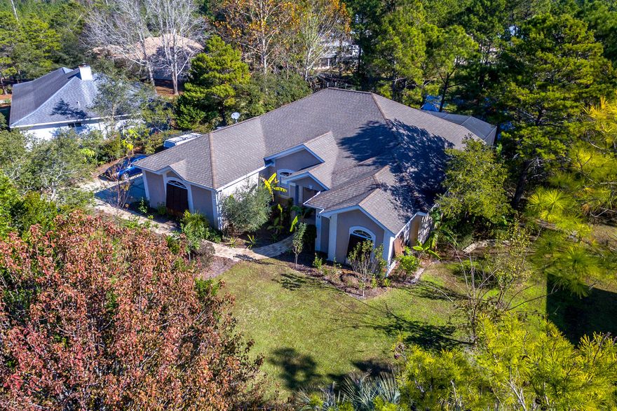 Welcome home to this one level, lake front home in lovely Country Club Hills, steps from the Santa Rosa Golf Club. Perfect full time and second home neighborhood just a short jaunt to 30A and the beach. This well-kept home on a large lot has an inground pool placed within a huge patio-all enclosed, an ideal setting for relaxing alone or entertaining a group. The private dock completes a special and idyllic place. The updated kitchen and glass lined breakfast nook have lake views, as does the family room. The huge 672 sf master suite also has a lake view and includes a large walk in closet in the large master bath. This very livable home has two guest bedrooms, a large laundry room and small private office space along with a full 2 car garage and golf cart garage space.