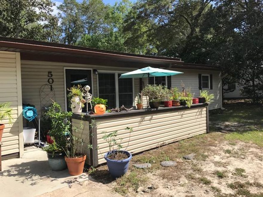 Nice updated home. 4 bedroom split plan floor plan, 2 baths. Updated kitchen with oak cabinets and breakfast bar. Tile flooring and ceiling fans throughout the home. There is a separate laundry room. Good size backyard and small court yard out front.