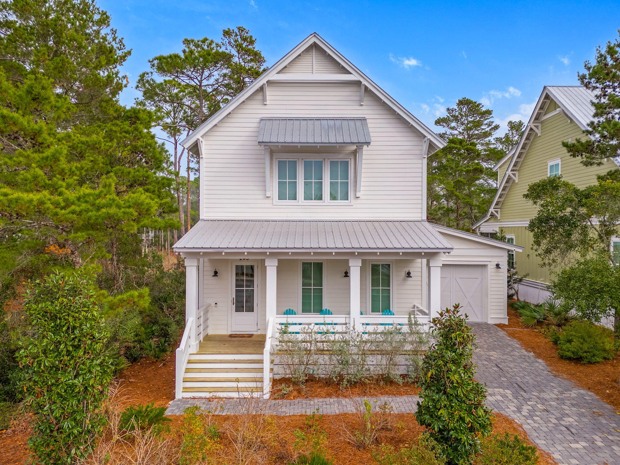 Welcome to your coastal Florida DREAM home! This 5 bedroom, 4.5 bath coastal retreat in Lakeside at Blue Mountain Beach is waiting for you! Upon entering this craftsman style home, you're greeted by tons of natural light - enhancing the open, bright, and airy feel. The first floor consists of 1 of the 3 primary sized bedrooms with ensuite, the open concept kitchen, living, and dining areas, laundry, and a half bath. A chef's dream of a kitchen with beautiful leathered granite countertops, GE Cafe' gas range, kitchen island with breakfast bar overlooking the living and dining areas to keep everyone included in the entertainment. Just off the dining area is a door to the enclosed patio that has an incredible nature view of the trees that line the lake - making a tranquil place to relax. Head upstairs to find the remaining primary suite and owner's suite, each with their own ensuite with tiled walk in showers, leathered granite double vanities, and featuring beautiful natural wood beamed ceilings in the bedrooms. Between those 2 rooms there are 2 bedrooms with a Jack&Jill bathroom. Schedule a showing today!