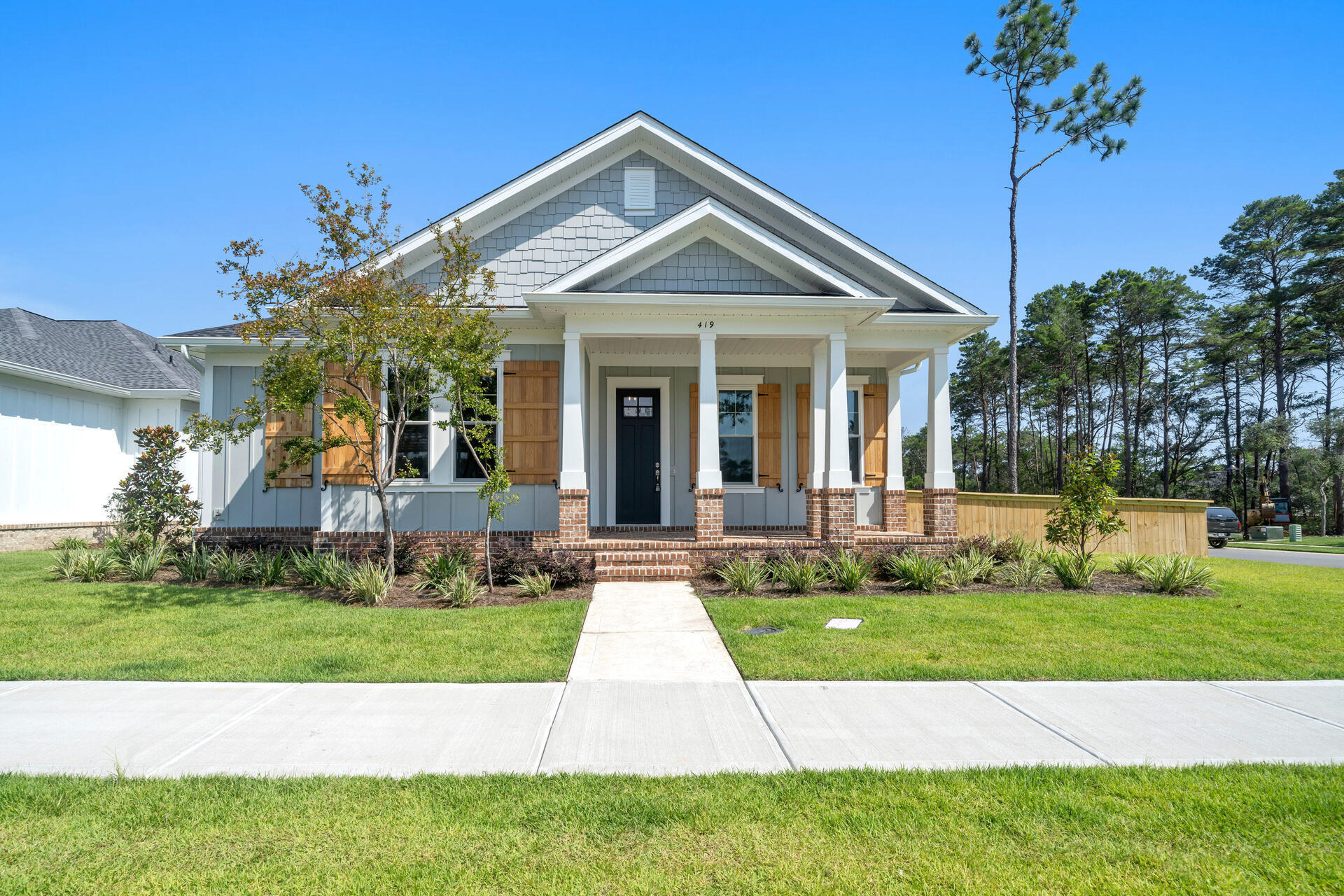 ****This beautiful Craftsman style single story home located in Niceville's newest community Deer Moss Creek has been lowered by 10K and is ready for you to call home! Situated on a large corner lot this home is just steps away from the new community center, pool, green space and basketball courts. Upon entering you will be welcomed by beautiful LVP flooring, neutrally painted walls, and the perfect open living space that includes an awesome side porch for entertaining. Did I mention this home boasts 5 bedrooms and 3 full baths, the 5th bedroom can be used as a sunroom, office/media room or mother in law suit with its own private entrance from the side porch. The kitchen is complete with GE appliances including a french door fridge, quartz countertops and custom shiplap hood vent.