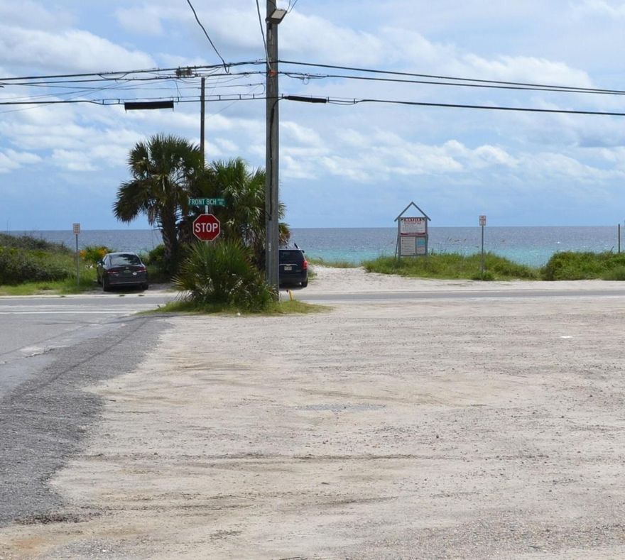 Wonderful opportunity to live just feet from the Gulf of Mexico! This log cabin is a great buy for air b&b or family use. Great beach access and near all of Panama City's hot spots. It is zoned commercial and could be a development opportunity for up to 50' or 4 stories. It is being sold furnished with some exceptions.
