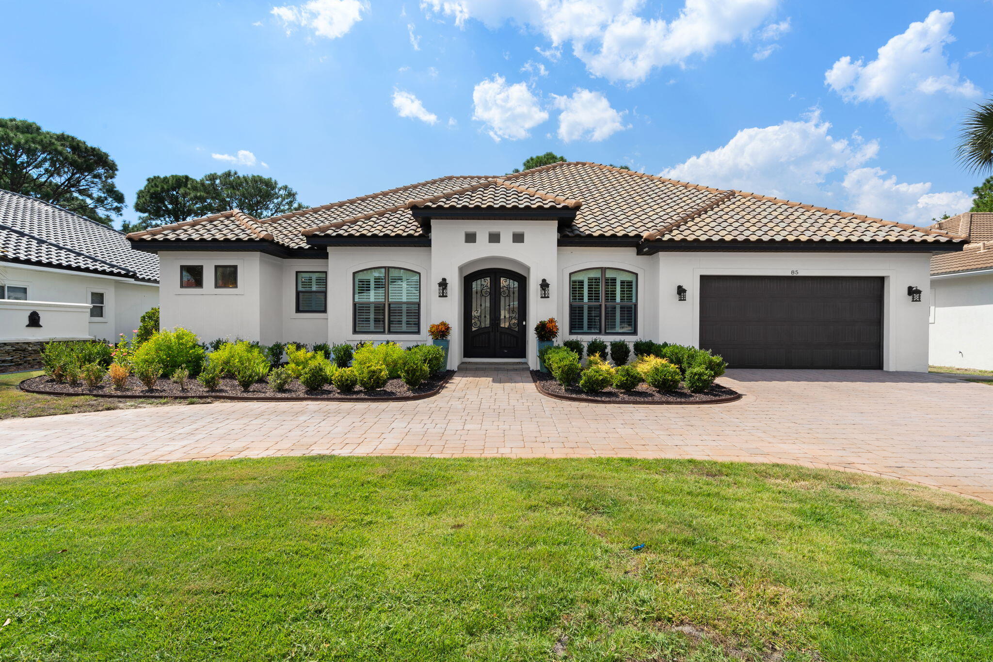 FLORIDA LIVING AT IT'S FINEST!!! Located in the Golf Course Community of Emerald Bay sits this UPDATED, IMMACULATE ONE LEVEL 3 Bedroom with a Den(4th Bedroom) 3 Bath Open Floor Plan Move In Ready Home. Located on the 17th Hole of The Emerald Bay Golf Course with Bay Views. The Home has a Great Outdoor Living Area with a Large Covered Lanai, Salt Water Pool with Spa Tub, Fireplace and Summer Kitchen. State of the Art Kitchen with 2 Islands, Butler's Pantry, Farm Sink and Top of the Line Appliances that Opens to the Spacious Living/TV Area. Private Primary Suite has Large His & Her Closets, Walk In Shower, Separate Tub and Double Vanity.