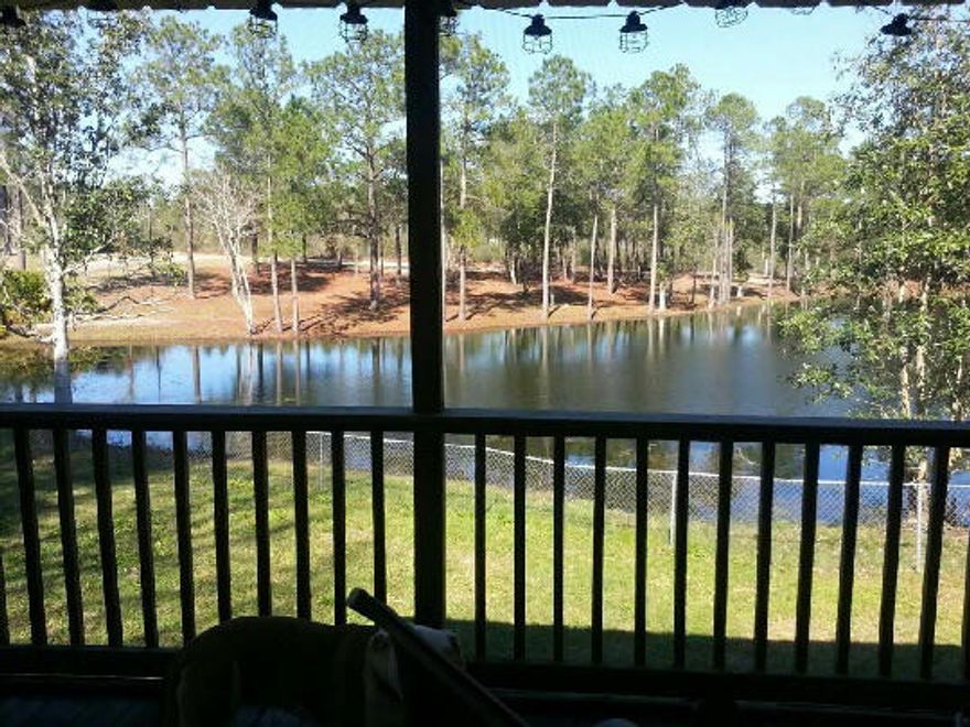 Go fishing in your backyard! SOUTH of I-10 with a LARGE lot overlooking a LAKE! This 4 bedroom 2 bath home is a single story design with 1 bedroom located upstairs. If you don't need 4 bedrooms the upstairs room makes an excellent theater room, rec room or mancave! New Laminate wood flooring and New carpet with upgraded pad throughout! You will appreciate the space this home has to offer. The living room is oversized with a vaulted ceiling and a gas fireplace and glass doors leading to the deck. The Eat-in-kitchen features a moveable island, tile floors, a dining area, and a cheerful window with a view of the lake. If you are looking for an affordable home with a huge yard, large bedrooms, and some recent upgrades don't miss seeing this home.Owner has orders and is motivated to sell quick!