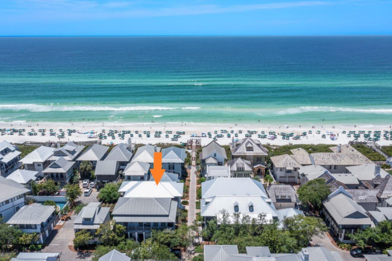 Gulfside in Rosemary Beach, this charming, well-designed designed coastal home is just steps from the beach walkover with the front porch facing the boardwalk.  Recently renovated by architect, Darrell Russell of A BOHEME Design and builder, Chris Ritchie.  Poised just a few tiers back from the Gulf and features an incredible and spacious outdoor oasis, providing a great place for friends to gather and a place to entertain. The first floor hosts the main living areas with tall ceilings and, hardwood floors and crown molding throughout the home.  The spacious living room allows for ample seating and comfortable living.  The kitchen is a perfect gourmet space to prepare everything from light appetizers to full meal entrees and features