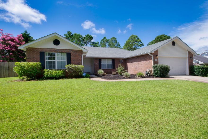 A thoughtful open plan layout: This 4 bedroom, 2 bathroom, split floor plan home of 2,260 sq. ft., rests on an elevated .46 acre (per county) lot; situated on a peaceful tree-lined street in the desirable Holley by the Sea neighborhood. Beyond the functional entryway space this home flows into a luminous, open-concept living, dining, and kitchen area complete with vaulted ceilings & large windows throughout. Spacious kitchen is equipped with a new suite of fingerprint-less stainless steel appliances, from Samsung, including a door-in-door Refrigerator, smooth-top range, built-in microwave, sleek design dishwasher, separate pantry, center island, updated lighting, custom butcher block hop-up bar, and window lined breakfast area overlooking the backyard. Hallway just off the living area
