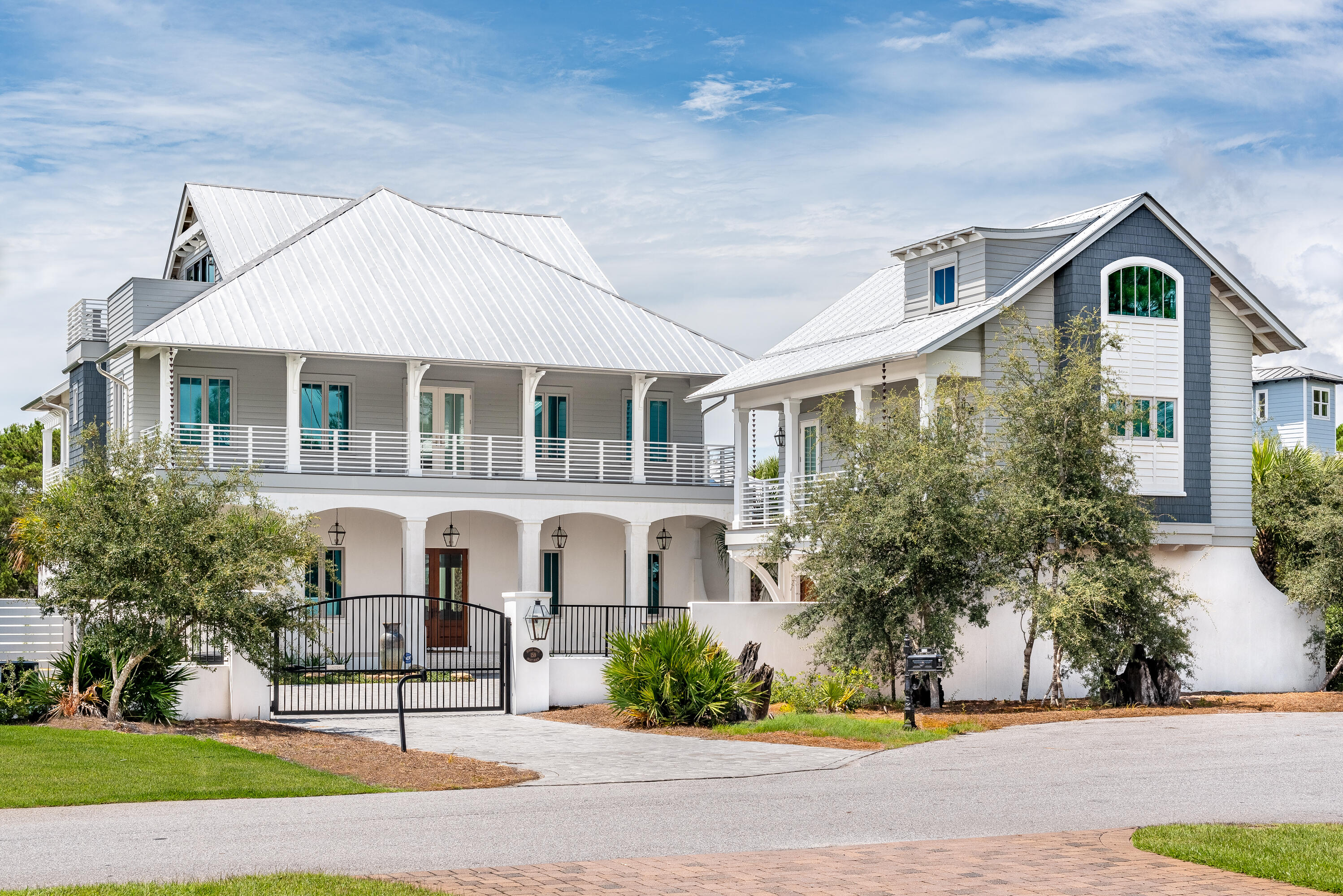 Located just steps to the beach, this ideal location offers privacy and serenity while still being a short bike ride from all the fun. Drive through the private gate of 159 Brenda Lane and you'll find a gorgeous coastal masterpiece. Built like a fortress the first floor of this home is constructed out of concrete block. Featuring 6 bedrooms, 9 bathrooms, a game room, a media room, a wine cellar, elevator, carriage house, and gym there is no shortage of space for family and friends. Custom-built in 2018, every detail was crafted with the utmost of luxury in mind. Including first-floor chef's kitchen outfitted with Wolf and Subzero appliances perfect for the chef in the family. Have family or friends stay in the carriage house; featuring 2 bedrooms, 2 bathrooms