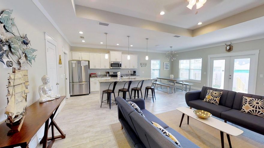 Great Rental History, fully furnished, sensibly priced and walking distance to the beach. The double garage and covered front porch make a great first impression of this modern home, which was completed in 2017. The open floor plan provides a huge space for socializing or relaxing. Calm neutral dcor and coastal accents add to the relaxed ambience of the bright and airy living area which boasts wood-effect flooring and a 9-foot ceiling. For the eco-conscious, the home includes energy-saving nest thermostats and a 40-amp garage plug for electric cars. The open-plan kitchen with its soft-close cabinets is at the heart of every mealtime. There's plenty of room at the granite breakfast bar. Move over to the formal dining area for entertaining in style, or dine and chill outdoors on the broad c overed deck. The private fenced yard is perfect for containing playful pets and energetic youngsters. Paneled doors lead to a useful laundry room and three generous bedrooms including a bunk room. Check out the walk-in closets and master ensuite with dual under-mounted sinks and oversize walk-in shower. Beach lovers and outdoor enthusiasts will appreciate the proximity of the public beach access, just two blocks away. The alluring white sandy beach and emerald waters are perfect for swimming, fishing, walking and boating. Rosemary Beach on Scenic 30A is close by for shopping, dining and social activities.