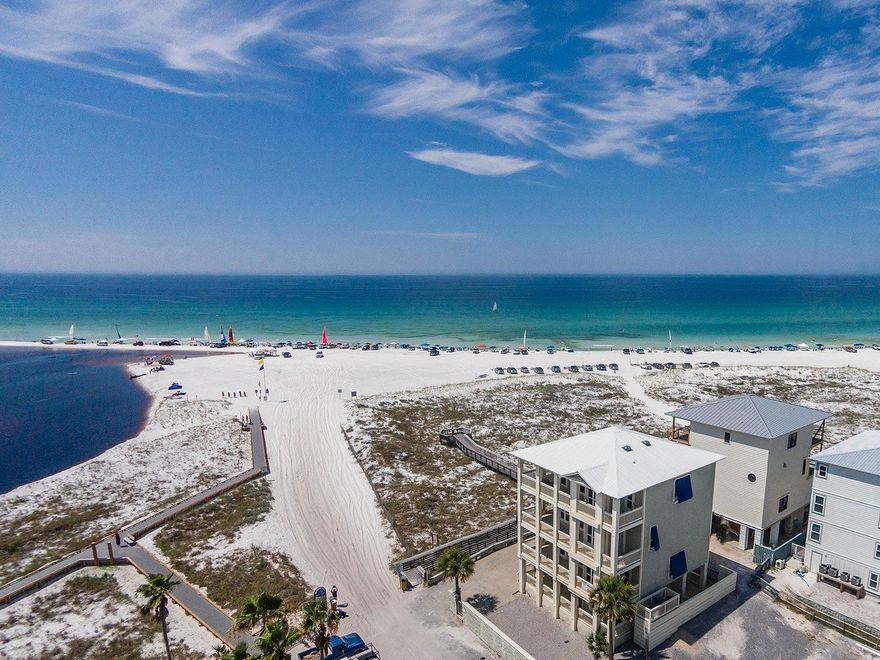 PRICE REDUCED ANOTHER $140,000!!! SELLER SAYS 'BRING OFFER!!!'- Well appointed 'Hawk's Nest' provides unparalleled, spectacular panoramic views of the Gulf of Mexico, Western Lake and Grayton's vast state-preserved dunes and beaches. Located in the heart of Old Grayton Beach, this multi-level,traditional beach house features 2,996 sq', 5 bedrooms, 4.5 baths, a very grand Great Room (kitchen, living, dining) with huge windows, 10' ceilings, granite countertops and hardwood oak floors. ALL NEW APPLIANCES, FLOORING, BEDDING & FURNISHINGS IN MARCH 2015!!! Master Bedroom and 2 of 4 other bedrooms open onto the wrap around decks on each of the top 3 floors. See the Gulf, lake, State beaches, and even Seaside from these balconies!BEST BEACH FRONT DEAL!!!