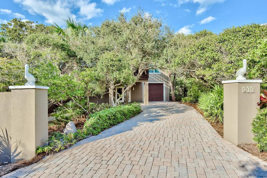 This is a very special property in a fantastic location! Enjoy spectacular gulf views in a quiet, secluded setting! This 2 bedroom, 2 1/2 bath home is situated just 100 yards from the Stallworth beach access and is nestled among mature oaks and magnolias. The house offers wraparound porches and a large observation deck all constructed in Ipe Brazilian hardwood. Completely remodeled in 2008, the main level has a large master bedroom with ensuite bath and large walk in closet featuring custom built in cabinetry. The great room/kitchen area has stainless appliances and granite countertops. There is a half bath, separate dining room and a spacious light filled sitting room with custom cabinetry and wine fridge.