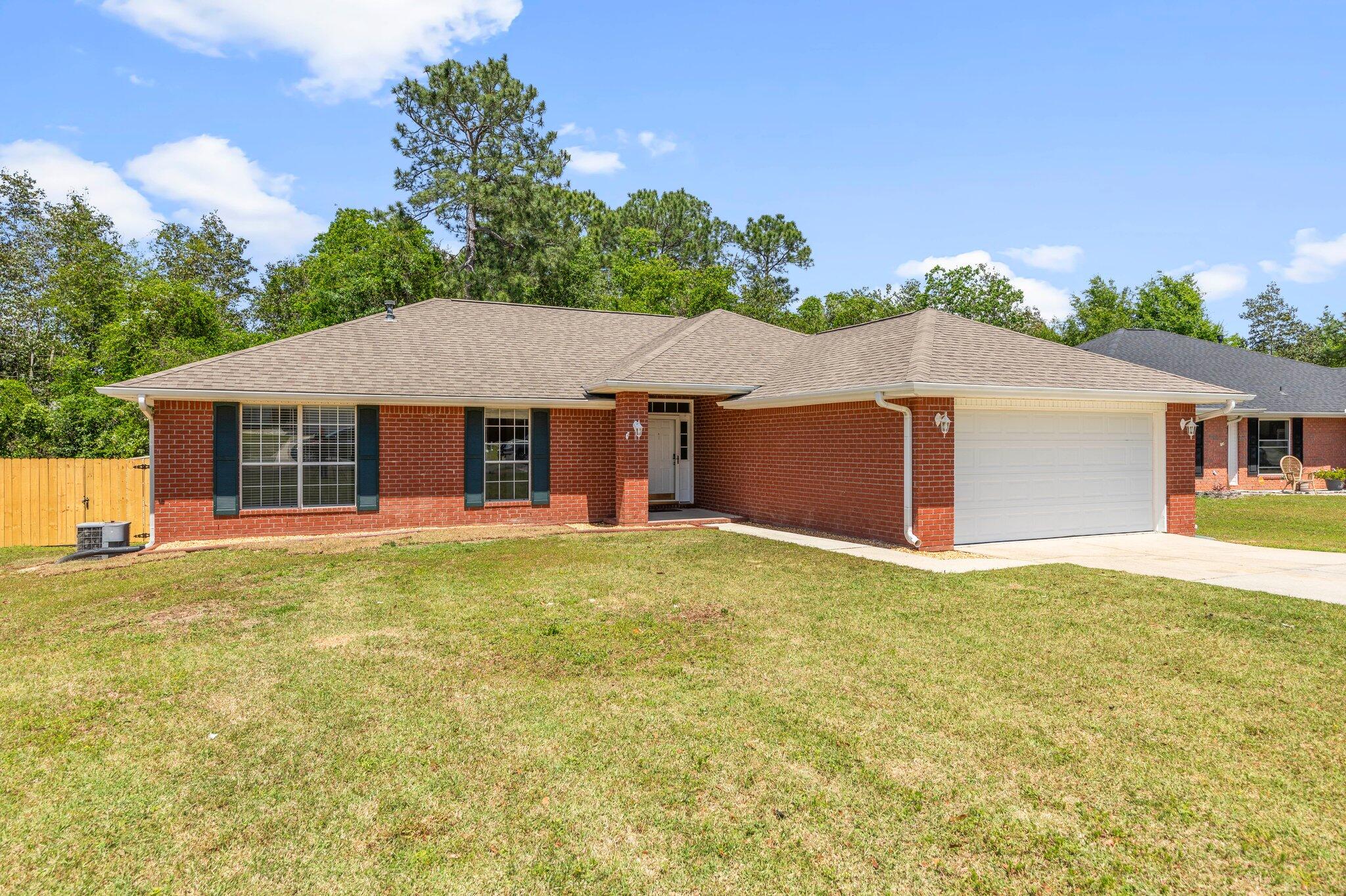 All-brick charmer conveniently located south of I-10! The open floorplan along with the cathedral ceiling and great natural light give this home a spacious and inviting feel - great for entertaining! Roof was replaced in 2020. Gas fireplace with custom tile hearth. Kitchen features include a breakfast bar and lots of cabinets and counter space! Spacious master bedroom. Master bathroom includes garden tub, double vanity, separate water closet, and large walk-in closet with custom built-in shelving. Two additional bedrooms and split floorplan for added privacy. Fully NEW fenced backyard includes a NEW deck and additional patio space. This home won't last long.