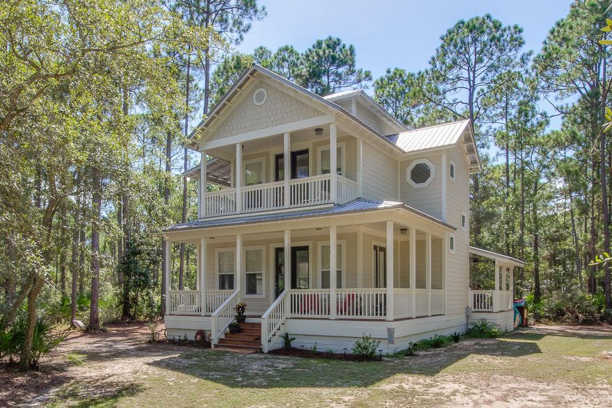This home speaks volume for itself. The view of the house from the curb takes your breath away but there is so much more to be seen on the inside. Up the front stairs of the wrap around covered front porch, enter through the double doors to the spacious open floor plan.This large living area is finished with laminate wood flooring, a gas fireplace and has lots of windows which keeps the home bright and airy. The living room flows directly into the eating area which flows directly into recently updated kitchen. The kitchen is finished with granite counters, breakfast bar, stainless steel appliances, and custom cabinetry.Each bedroom is a private retreat with its own full bath and large walk in closet. The 2 upstairs bedrooms have direct access to a personal balcony.