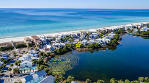 Truly once-in-a-lifetime opportunity to build your dream home in the heart of Carillon Beach. Two adjacent lots on Lake Carillon with 120' ft. Beachside drive frontage and GULF-VIEWS from your new home. This is the last opportunity to buy 2 contiguous lots on the lake and across from the gulf. Building design is subject to Carillon Design Review Committee, but these two premier lots allow for the creation of a main home and guest home totaling about 5500-6000 sqft. As close as you can get to the gulf, without being ON the gulf and paying premium prices for gulf-front lots and building on the gulf. Space for private pool, though community pool on the gulf is just steps up Beachside Drive. NOTE: Both lots are to be sold together. Buyer to verify all dimensions/building restrictions.