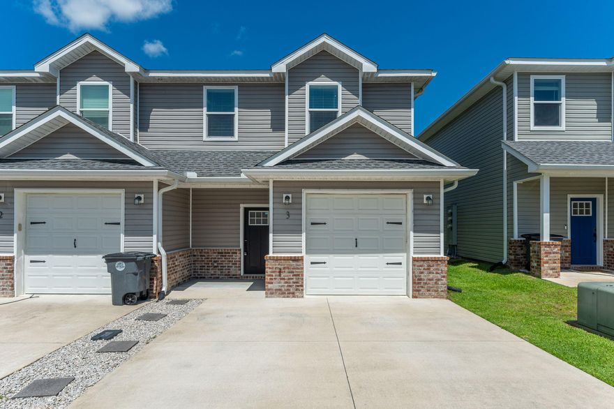 Welcome to this beautifully designed three-bedroom, two-and-a-half-bath townhome located in the heart of Valparaiso. Built with newer construction, this home offers both style and function, featuring luxury vinyl plank flooring, tall ceilings, and a spacious, light-filled living area complete with a ceiling fan. The open-concept chef's kitchen is perfect for entertaining, boasting stone countertops, a tile backsplash, stainless steel appliances, a gas range, custom shelving in the dining area, and a large center island ideal for gathering. A custom-tiled half bath completes the thoughtfully designed main floor. Upstairs, plush carpeting adds warmth to all bedrooms, including a spacious primary suite with a walk-in closet, dual vanities, and a stunning tiled walk-in shower with dual showerheads. The guest bathroom also features dual sinks, a large vanity, and a tub-shower combo for added convenience. The laundry room is located upstairs for everyday ease. Enjoy additional perks like a single-car garage with custom storage shelves and hooks for bikes or outdoor gear. Outside, a small fenced-in patio offers just the right amount of space for grilling, dining, and relaxing outdoors.This townhome combines comfort, modern finishes, and low-maintenance livingall in a desirable Valparaiso location.