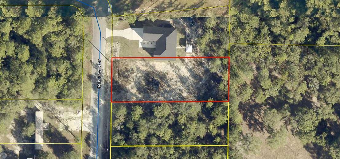 GREAT BUILDABLE LOT! Cleared lot with an 8' privacy fence across the back of the lot. Build your new home or bring your mobile home. Tap fee has been paid and land has been surveyed. Call for a showing today!