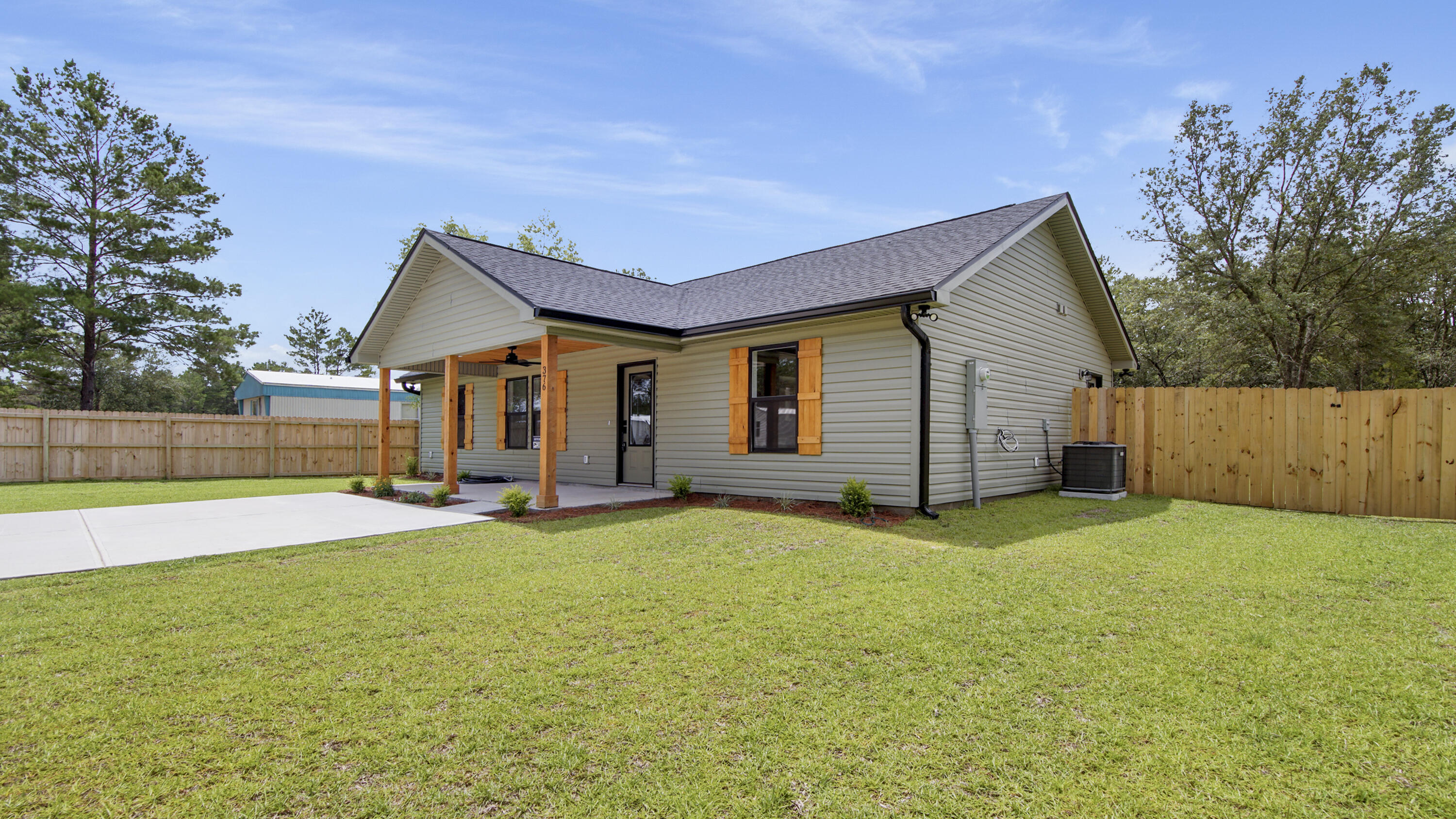 This beautifully crafted new construction offers both style and value in a peaceful setting. From the inviting front porch with cedar posts and cedar-clad ceilings to the luminous open-concept interior featuring luxury vinyl plank flooring and vaulted ceilings, every detail has been thoughtfully designed. The kitchen is a standout with quartz countertops, farmhouse sink, soft-close cabinets, and sleek stainless steel appliances--ready for your family feasts. Pantry located just steps away in expansive laundry area. Relax in the private primary bedroom with an en-suite bath showcasing a tiled shower and elegant fixtures. Outside, a 6 ft privacy fenced yard and spacious lawn await barbecues or backyard games. ! Seller offering $9,000 in closing with full price offer.
