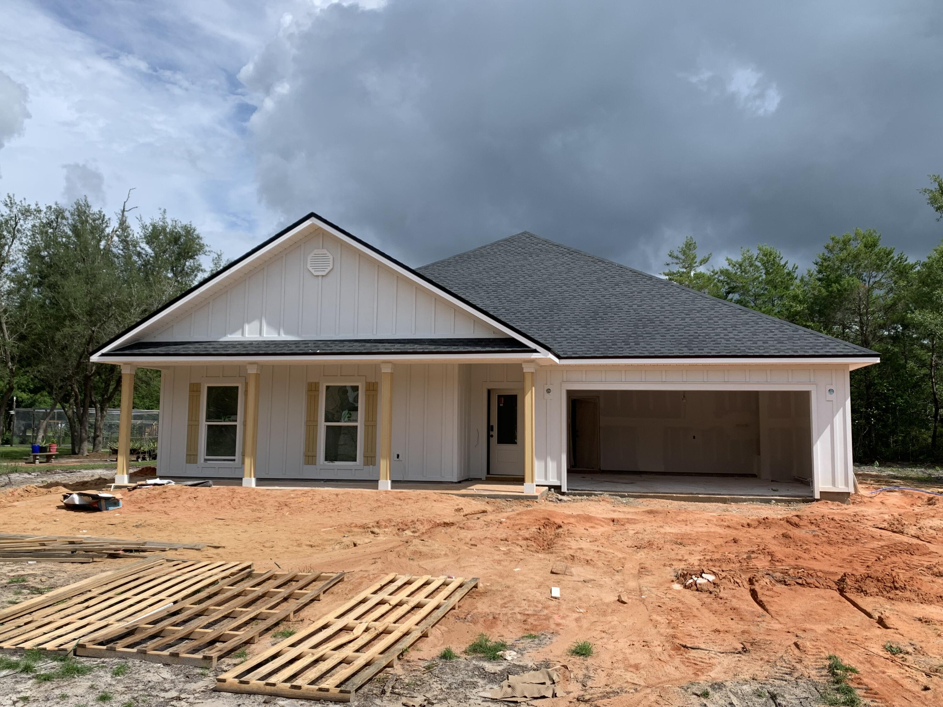Discover this fantastic new construction home situated on a half acre lot at the end of a cul-de-sac inside one of Freeport's best kept secrets, Indian Bay! The wide, covered front porch offers a warm Southern welcome to a beautifully laid out, split bedroom floor plan featuring an open-concept kitchen, living, dining area at its heart. Three spacious bedrooms, a full bath with double sink vanity, and a dedicated laundry room occupy one wing of the home, while the primary bedroom and en suite bath with tiled shower, garden tub, double sink vanity, and massive walk in closet sit on the opposite side of the living space. Find a conveniently placed powder bath in the hall leading to and from the 2-car garage. Home will be finished with quartz counters and shaker-style cabinets in kitchen and