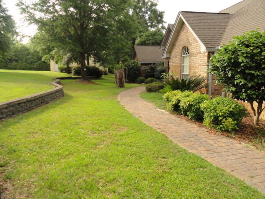 Are you looking for a home that has it all? RV parking, 3.3 acres waterfront, salt water pool with screened enclosure, detached 2 car garage and enough parking for any family gathering. Unique property situated so close to town yet in the county with lower taxes. The 3000+sf Brick home has a extra Mother in law suite with a sitting room and private bath. This home has fresh paint, new hardwood floors and updated back splash in the kitchen. Spilt bedroom design allows privacy for the Master Suite. Master suite features a sitting area with gas fireplace. Master bathroom features his and her closets, couples shower, separate vanities and a whirlpool tub. Guest bedrooms feature a Jack & Jill bathroom. Bedroom 2 has a sliding door to the Florida room. Schedule your showing today!