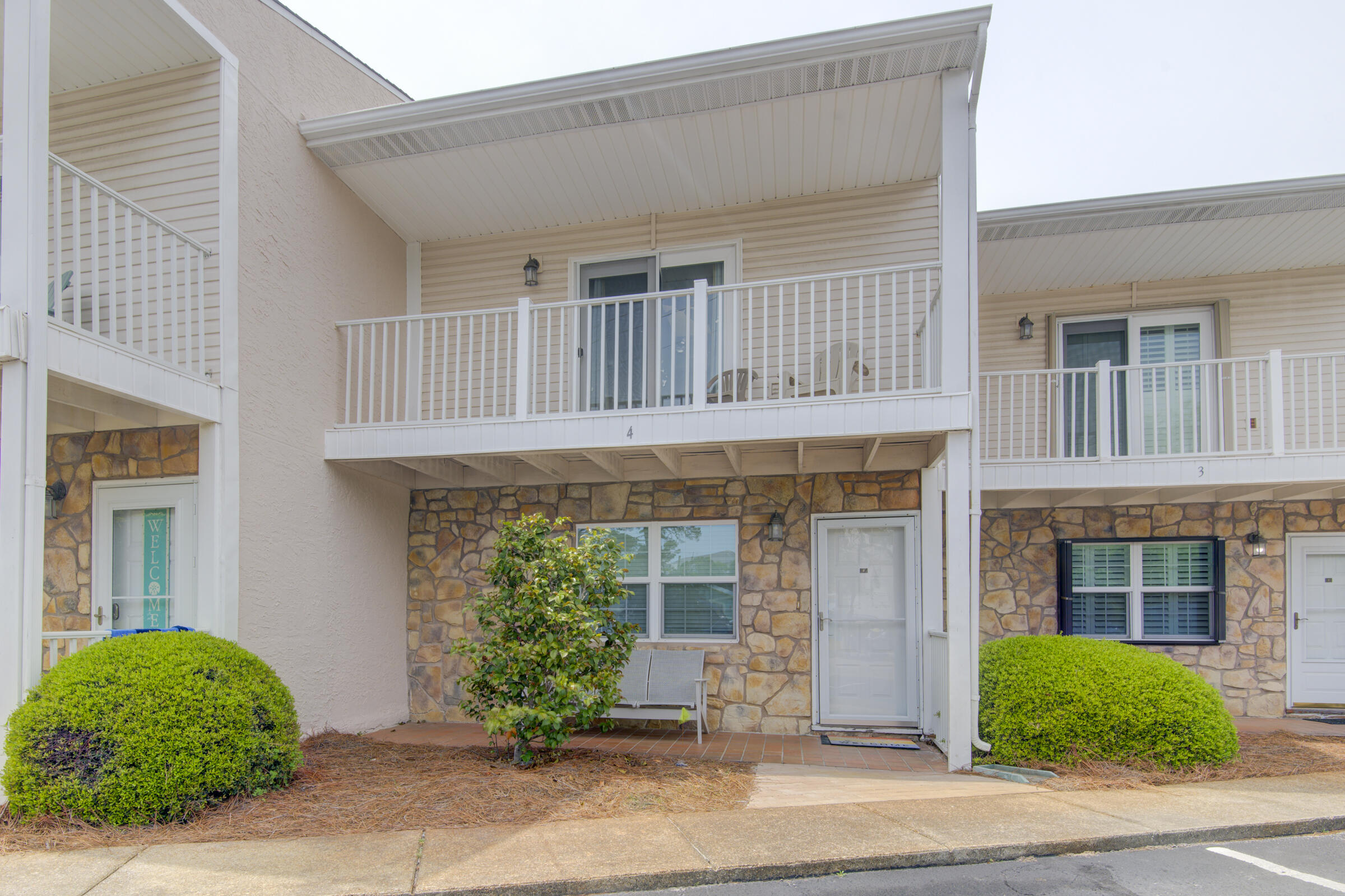 Welcome to this beautifully maintained  fully furnished 2-story townhome in the desirable Woodland Shores community-- within walking distance to the sugar-white sands and emerald waters of the Gulf, a short distance to the outlet malls, Baytowne, scenic highway, entertainment, and eateries. Woodland Shores is a charming, well-maintained complex featuring beautifully landscaped grounds, two sparkling community pools (one heated), and tranquil common areas designed for relaxation offering a clubhouse , kitchen, library, and grilling area --all in a prime coastal location. This spacious 1,300 SF unit boasts a bright and airy floor plan with large windows that fill the home with natural light. Each level features its own private balcony, offering the perfect spots to enjoy the coastal breeze. With 2 generously sized bedrooms and 2.5 baths, this townhome is ideal for beach living, whether as a full-time residence, vacation retreat, or investment property. 
