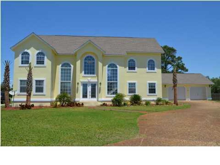 HUGE PRICE REDUCTION!! SELLER IS READY TO MAKE A DEAL on this stunning home. This amazing executive styled home is located on the popular Tiger Point Golf Course and offers amazing views of the golf course, Pensacola Bay, and the in ground pool! A beautiful 5 bedroom 3 bath home, this freshly refurbished home comes with large bedrooms downstairs, and the remaining bedrooms (including the master bedroom)upstairs. Nearly every room in this home has a view of the golf course or the Bay! Newly painted and newly installed intercom systems make this large 3600sf plus home just that much more inviting. All new stainless steel appliances in the kitchen, new light fixtures throughout, and new faucets in baths. The full baths are full of stone tile and the master bathroom is oversized and amazing.