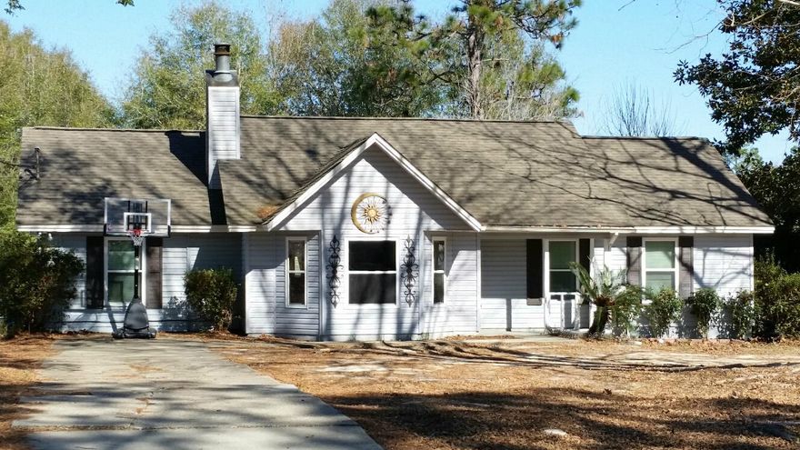 SHORT SALE!! Nice home south of I-10 and just minutes to Duke Field. Home has laminate wood & tile flooring and carpet in Family Room is 1 year new! Living room complimented by cathedral ceiling & wood burning fireplace. Kitchen offers granite counter tops with decorative backsplash, built-in microwave and smooth top stove. Water heater was replaced in November 2014. Sliding glass door and all front windows were replaced in 2011. The garage was converted to a familiy room or could be a media room or perfect for a play room. Entire Septic tank & drain lines replaced in 2013. New roof in 2010. Nice size deck and large back yard. Fenced back yard with a yard building for storage. All measurements & demensions are approximate, Buyers to verify.