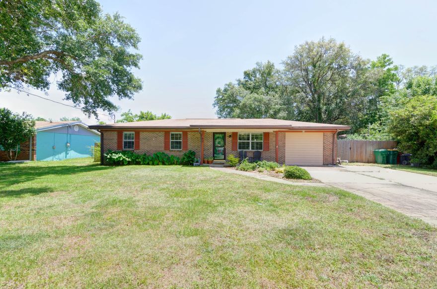 Welcome home to this move in ready and fully renovated all brick 4 bedroom, 2.5 bath Shalimar retreat. Enjoy a short commute to Hurlburt Field or Eglin AFB, and have peace of mind with the roof, HVAC, water heater, and whole home rewire all done in 2018! Pull into the oversized and expanded driveway and walk up to the covered front porch. Inside you'll appreciate the lovely hard surface flooring through all the common areas, and the tasteful chair rail and baseboard molding in the dining room. Open to the fully renovated kitchen you'll love this space adorned with granite countertops, white shaker cabinets, stainless steel appliances, and subway tile backsplash complete with a built in butch block! From the kitchen you'll love relaxing in the living room with sliding glass doors to access the backyard, and access to the spacious interior laundry room. This split floor plan allows for master bedroom privacy, and in that owner's suite you'll find a walk-in closet and a bathroom complete with a walk-in tiled shower, tiled floors, and a double vanity with granite counters. There is additional access to the backyard from the master bedroom. Down the hall, on the other side of the home, are three bedrooms (all bedrooms complete with ceiling fans) with a beautifully tiled full bath and granite-topped vanity. One bedroom features a walk-in closet and a bonus half bath that boasts an additional closet. In the backyard you'll find a great sized fully fenced in space to enjoy with a sprinkler system. Come appreciate Emerald Coast living in a fantastic location! 