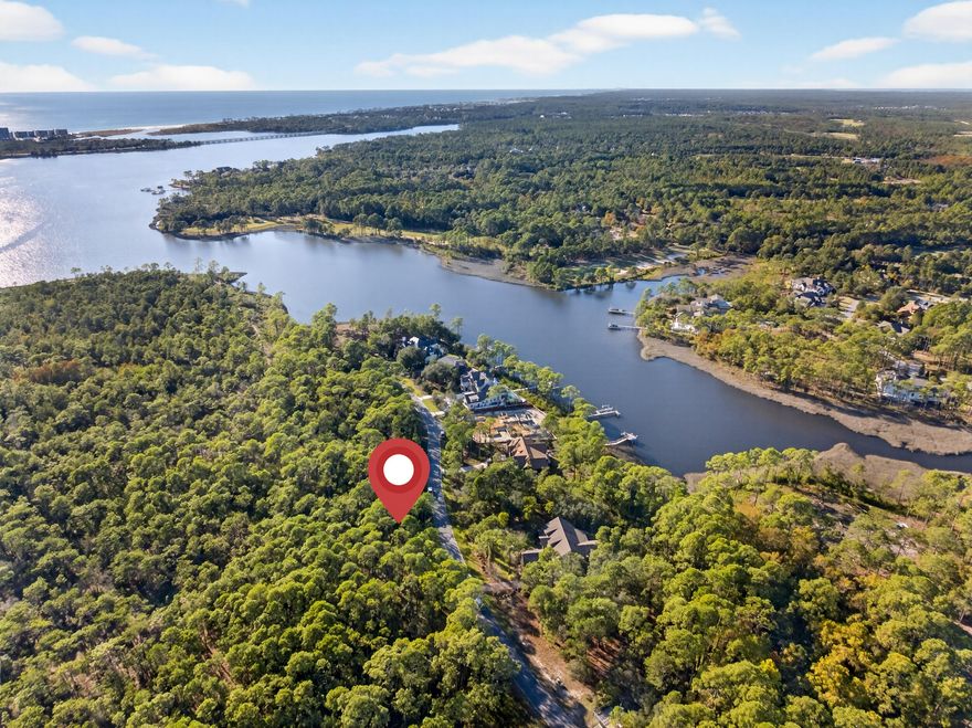 Build your dream home or vacation retreat on this spacious and private .54-acre homesite surrounded by lush natural vegetation. This highly desirable Type A lot is one of only a few remaining of its kind and offers an ideal location near the gated front entrance of Wild Heron. Situated in Flood Zone X, this property requires no flood insurance and has no build-out time, giving you the flexibility to design and build at your own pace.Wild Heron is a 734-acre gated coastal sanctuary and non-rental golf community nestled along the shores of Lake Powell, ideally positioned between Inlet Beach and Panama City Beach. Enjoy 24 miles of pet-friendly walking and biking trails, a heated pool and hot tub, fitness center, playground, fire pit, and a boathouse stocked with kayaks and paddleboards, providing easy access to Lake Powell and the white sandy beaches of Camp Helen State Park.
For those seeking a premier coastal lifestyle, join the Watersound Club to enjoy access to three exceptional golf courses, including two within the Wild Heron community and the newly built The Third Golf Course, as well as multiple resort-style pools and a private beach club. Sharks Tooth has a recently renovated clubhouse, elevating the lifestyle experience for residents and members alike.