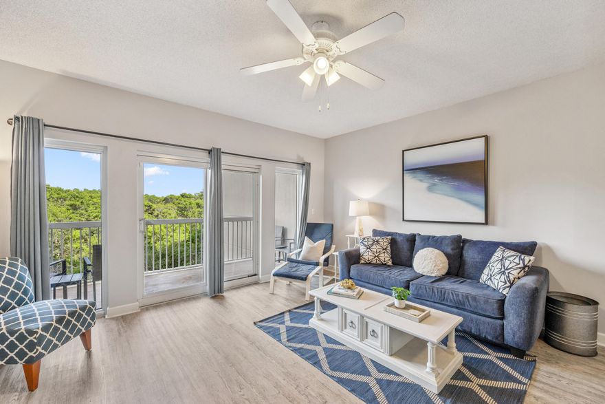 Experience the Best of Coastal Living at The Summit in Tops'l Beach & Racquet Resort! Enjoy peaceful views and an unbeatable location in this beautifully priced 2-bedroom, 2-bath condo overlooking the serene nature preserve of Topsail Hill Preserve State Park. Nestled within the prestigious gated community of Tops'l Beach & Racquet Resort, this east-facing unit offers a tranquil setting where you can sip your morning coffee while watching deer and other wildlife from your private balcony--accessible from both the living area and the primary suite. The interior features a bright open concept layout with updated luxury vinyl flooring for low-maintenance beach living. Sold fully furnished and turn-key, the unit was recently refreshed with new coastal decor (staging items for a minimal fee). The cheerful kitchen includes white appliances, a brand-new microwave, ample cabinetry, a pantry/owner's closet, and a breakfast bar ideal for casual dining. The kitchen and dining area also captures calming nature views.

The spacious primary suite features a king bed, a sitting area, balcony access, and large windows that bring in great natural light & peaceful views. The elegant en-suite bath includes a double vanity and shower/tub comboperfect for a relaxing soak. The guest bedroom offers two twin beds and a split-bedroom layout for added privacy, plus charming barn doors on the closets and flat screen TVs in every room. A second full bath and a stackable washer/dryer complete the space. The hot water heater was just replaced May 2025 to keep your mind at ease! 

Owners and guests at The Summit enjoy exclusive access to its private pool, hot tub, and BBQ area, as well as the world-class amenities of Tops'l Beach & Racquet Resort. Highlights include 600 feet of private beach, a beachfront pool and tiki bar, fitness center, indoor/outdoor pool, 12 Rubico lighted tennis courts, pickleball, basketball, shuffleboard, mini golf, and three on-site restaurantsall on 52 acres of lush, Gulf-front property. Whether you're looking for a full-time residence, vacation retreat, or income-generating investment, this condo at The Summit checks all the boxes in a truly one-of-a-kind coastal setting.