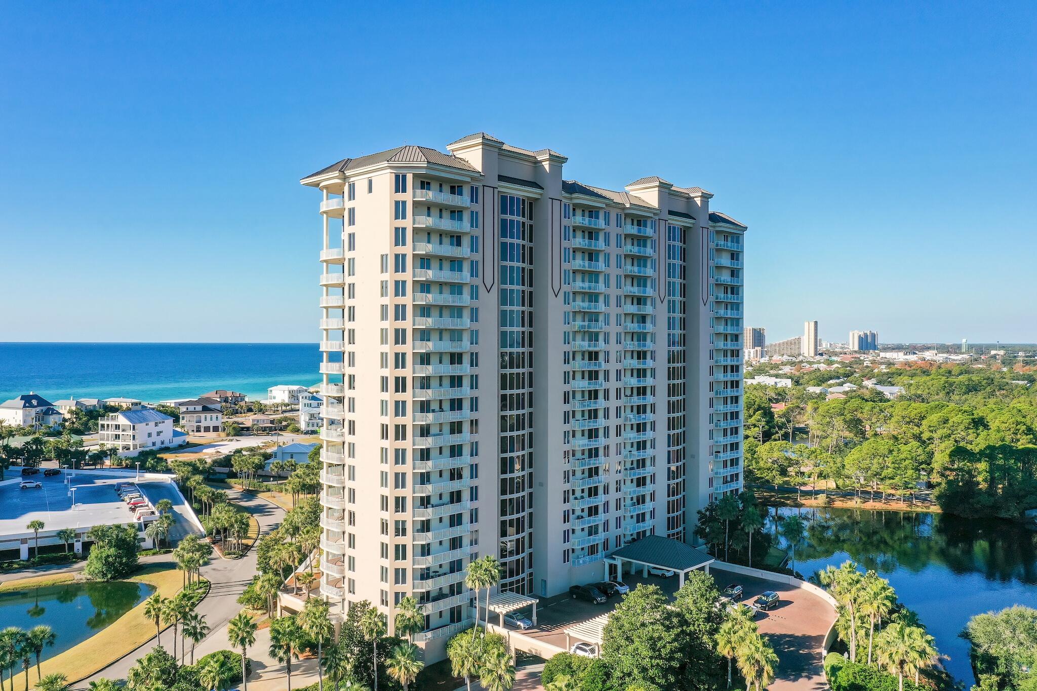 Ultimate luxury residence available now in the coveted and rental-restricted One Beach Club Drive private community in Sandestin Resort. This four bedroom condo is perfect for a second home or full-time residence. This corner unit with expansive lake views and large balconies that create a paradise in this exclusive building. This unit is being sold furnished. One Beach Club Drive is Sandestin's premier gated, non-rental codominium featuring garage parking, resort-style pool, Gulf Front Beach Club membership included, tennis, fitness center and media room. Sandestin Resort offers multiple championship golf courses, expansive tennis center with clay courts, Baytowne Marina, Village of Baytowne Wharf with its many shops and restaurants, as well as multiple owner