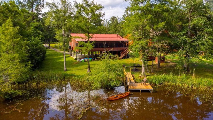 Remarkable Lake Home on an inlet of beautiful Point A Lake, a 700 acre lake known for fishing (bass, bluegill, shell cracker, crappie and catfish, etc), boating and other water sports. This one of a kind, charming 2 Bedroom/2 Bath retreat is located in Hideaway Harbor just minutes from downtown Andalusia. The location of this home is perfect for the kayak and canoe lover, put in the water directly from your back yard. For the adventurous, go just 8 miles up the adjoining Patsaliga River and navigate through 5 sets of rapids on the way back to your backyard! Skip the stairs and enter the home via your elevator (rated 1,000 lbs. or 4 adults). Once inside you will find gorgeous tongue and groove, wood siding in an open concept floor plan. leading onto the 500 sq. ft. covered, screened porch.
