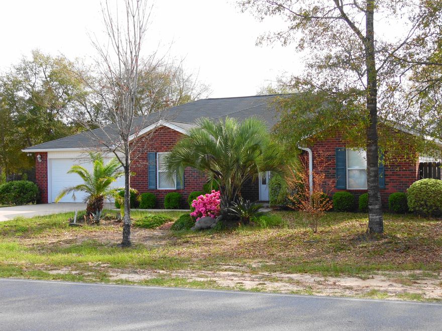 Super buy on this 1500+ square foot home in Mossy Head. 3 bedrooms,2 baths, Cathedral ceilings, great room, kitchen with oak cabinets, breakfast bar, appliances, breakfast room, dining room, inside laundry. Master bedroom has 2 walk-in closets, bathroom has double vanities, separate area for walk-in shower with 2 benches, exit door from master bedroom, to screened back porch, fans with lights in all rooms, exterior has motion detected security lights on each corner. Built in 2006 with 2500 sq. ft. under roof including porches, tile floors and carpet in the bedrooms, 2 car garage, corner lot. Backyard has privacy fence, garden area, own compost pile. This house will qualify for 100% financing, near I-10 exit, 18 miles to Eglin AFB, 20 minutes to Crestview,