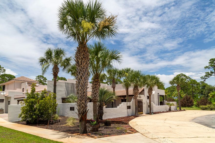 Fresh new look and new stucco! This thoughtfully designed Spanish 'Hacienda' influenced home is ideally located in the desirable 'Mack Bayou area' of Santa Rosa Beach offering an abundance of indoor and outdoor living and entertaining spaces including a spacious screened lanai with a pool, spa and multiple patio areas. The home also features a separate wing with private guest quarters. The main house includes a main living room; formal dining area and a spacious kitchen; a guest bedroom, guest bath and a master suite with en-suite bath all on the main level. A library-study guest-room is on the second floor. The offering also includes an attached double car garage on the side of the home and a detached pool/garden storage building in the back. A gated street-side entry opens into a welcoming courtyard and a lovely double tiered fountain as its focal point. From the courtyard is the main house entrance, as well as an attached, side wing with full guest quarters.  The guest wing includes a kitchen with small island bar, living area with woodburning fireplace, full bath, laundry and a private courtyard/patio off the side rear of the home. 
The very spacious living room features a fireplace flanked on either side by beautiful, built-in book cases. An expanse of windows and glass doors in the living room and adjacent formal dining area opens out to the rear screened lanai.   A well designed, oversized kitchen features pass-through windows to the patio- pool area; a comfortable sized breakfast nook; an oversized pantry; an abundance of kitchen cabinetry and storage along with a kitchen island.
The over- sized master suite located on the main floor features a fireplace and two separate side entries, each leading out to the screened lanai and pool area.  The master suite also includes a generously sized en-suite bath with walk-in shower; separate soaking tub; "his and hers" vanities and a huge walk-in closet with plenty of storage. 
The main floor living space is rounded out with a guest bedroom that easily accommodates a king bed and features its own, exterior side entry.  
The second floor of the home features an inviting room overlooking the pool and patio area with an intimate, screened side porch.  The focal point of this upstairs space is the gorgeous floor-to-ceiling, built-in book-cases.  The room has been serving as an office "study" library space but also includes a small, full bath and generous sized closet and is large enough to easily serve as an additional guest bedroom.  This home is located on Blue Bayou Dr and is a private road. An  additional lot (western side) may be available to increase the home's buffer for additional privacy. ***Buyer is responsible for personally verifying details about this property. Any information contained in this listing is believed to be accurate but is not guaranteed. ***